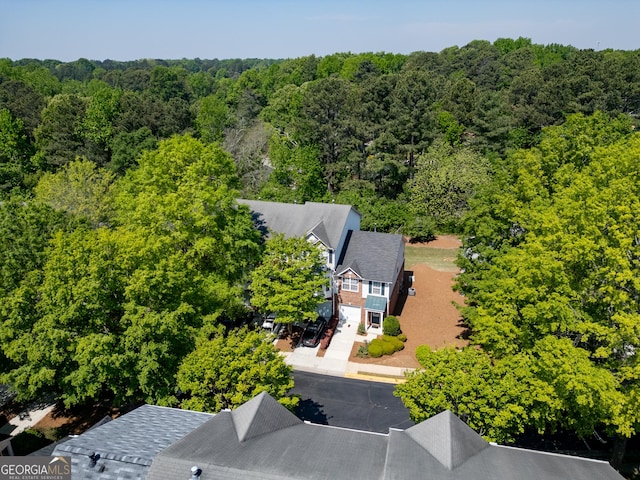 aerial view with a wooded view