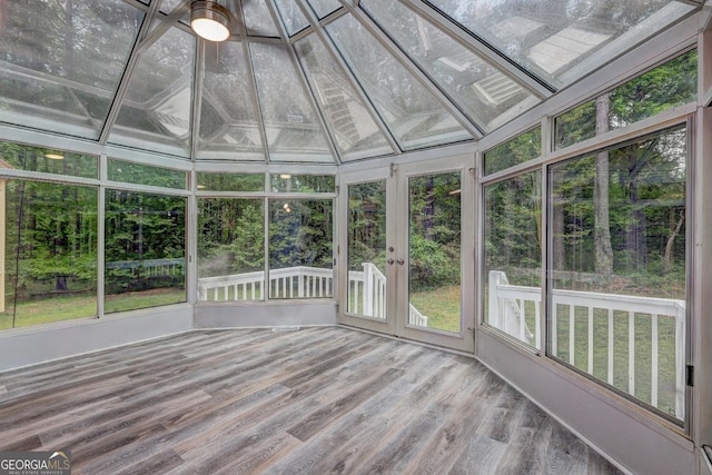 5621 Wildwood Trl, Lithonia, GA 30038 - unfurnished sunroom with a wooden deck, wood finished floors, a wealth of natural light, and french doors