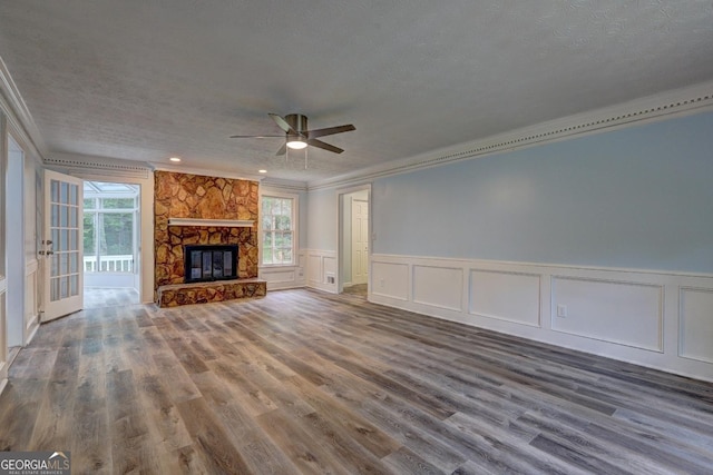 5621 Wildwood Trl, Lithonia, GA 30038 - unfurnished living room featuring a ceiling fan, a wealth of natural light, and ornamental molding