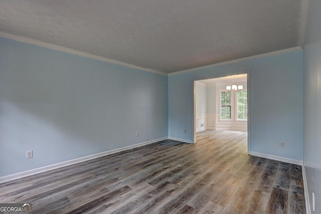 5621 Wildwood Trl, Lithonia, GA 30038 - unfurnished room featuring a chandelier, wood finished floors, crown molding, and baseboards