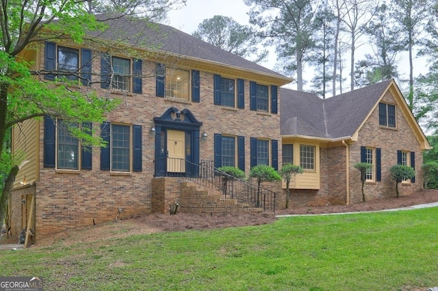 5621 Wildwood Trl, Lithonia, GA 30038 - view of front of property featuring brick siding, roof with shingles, and a front yard