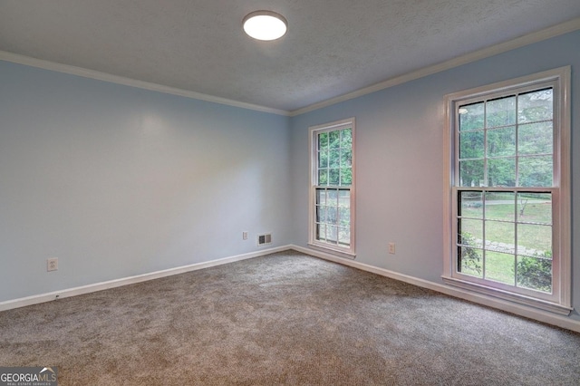 5621 Wildwood Trl, Lithonia, GA 30038 - carpeted spare room featuring baseboards, visible vents, a textured ceiling, and ornamental molding
