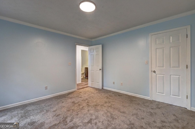 5621 Wildwood Trl, Lithonia, GA 30038 - unfurnished bedroom featuring baseboards, carpet flooring, and ornamental molding