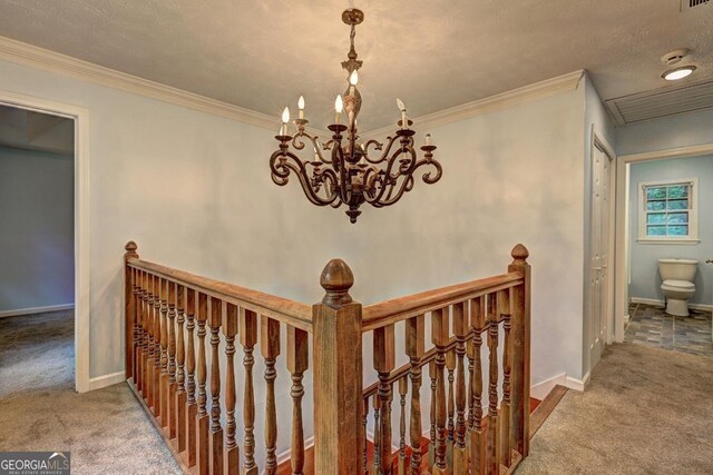5621 Wildwood Trl, Lithonia, GA 30038 - stairs with an inviting chandelier, baseboards, carpet, and ornamental molding