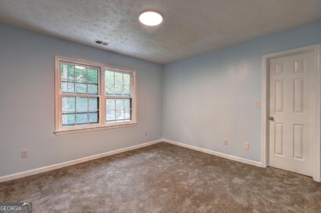 5621 Wildwood Trl, Lithonia, GA 30038 - unfurnished room featuring a textured ceiling, carpet floors, visible vents, and baseboards