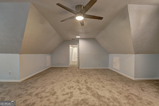 5621 Wildwood Trl, Lithonia, GA 30038 - additional living space featuring a ceiling fan, baseboards, carpet floors, and vaulted ceiling