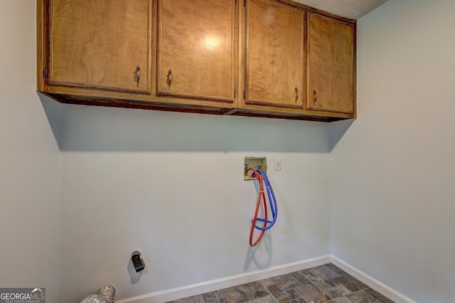 5621 Wildwood Trl, Lithonia, GA 30038 - laundry room with cabinet space, washer hookup, and baseboards