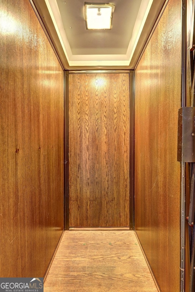 5621 Wildwood Trl, Lithonia, GA 30038 - room details featuring elevator, wood finished floors, and a raised ceiling