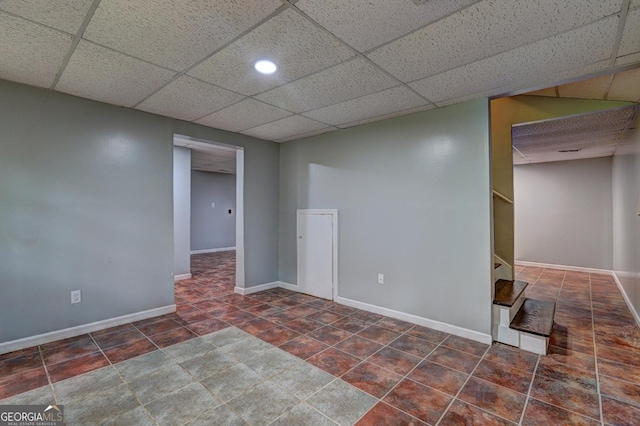 5621 Wildwood Trl, Lithonia, GA 30038 - finished basement featuring stairway, baseboards, tile patterned flooring, and a drop ceiling