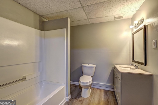 5621 Wildwood Trl, Lithonia, GA 30038 - bathroom with wood finished floors, visible vents, toilet, baseboards, and a paneled ceiling