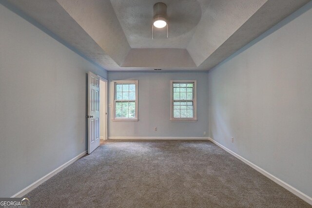 5621 Wildwood Trl, Lithonia, GA 30038 - empty room featuring ceiling fan, baseboards, carpet flooring, and a tray ceiling