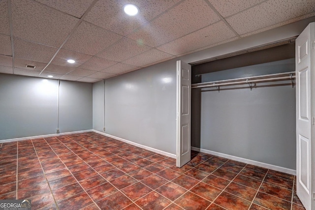 5621 Wildwood Trl, Lithonia, GA 30038 - finished below grade area featuring baseboards, tile patterned flooring, a drop ceiling, and recessed lighting