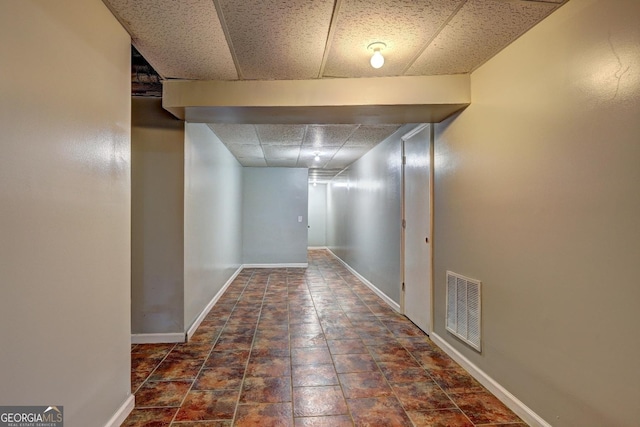 5621 Wildwood Trl, Lithonia, GA 30038 - hallway with baseboards, a paneled ceiling, and visible vents