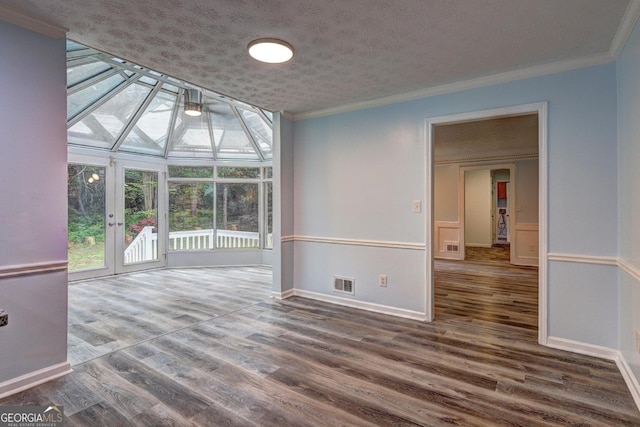 5621 Wildwood Trl, Lithonia, GA 30038 - empty room with baseboards, ornamental molding, wood finished floors, and visible vents