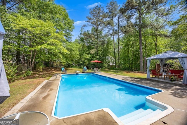 pool featuring a gazebo and a patio