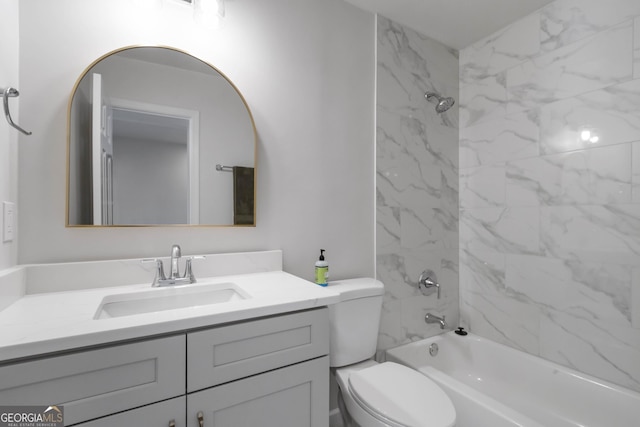 bathroom featuring toilet, bathing tub / shower combination, and vanity