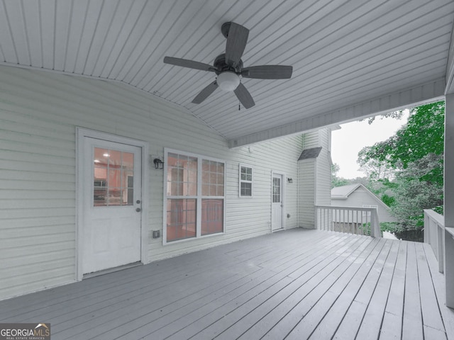wooden deck featuring a ceiling fan