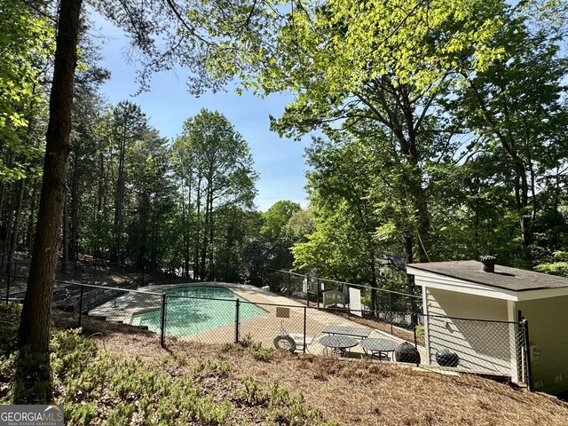 view of pool with fence and a fenced in pool