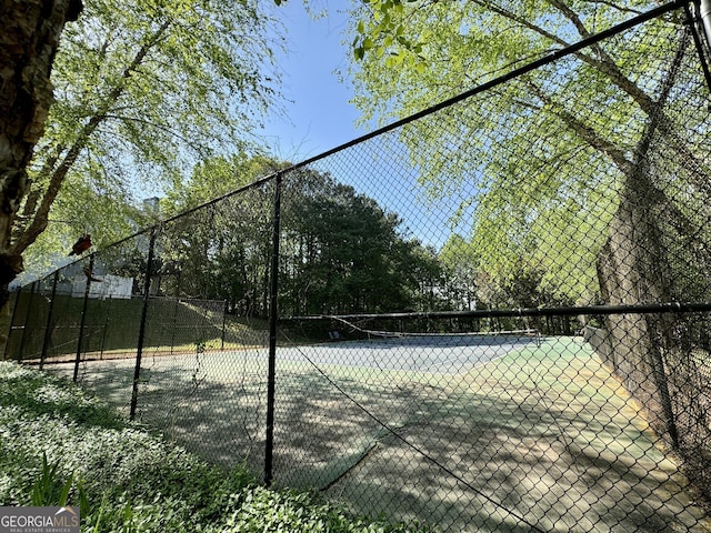 view of sport court with fence