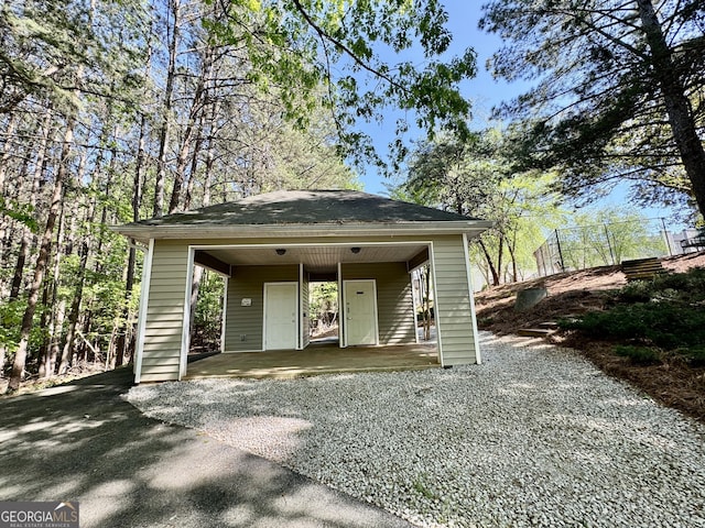 exterior space with driveway and a carport