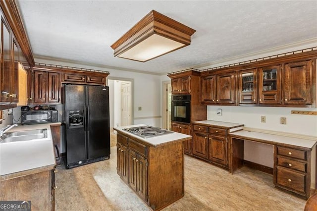 22 Oakwood Hills Dr, Suwanee, GA 30024 - kitchen with a kitchen island, light countertops, a textured ceiling, a sink, and black appliances