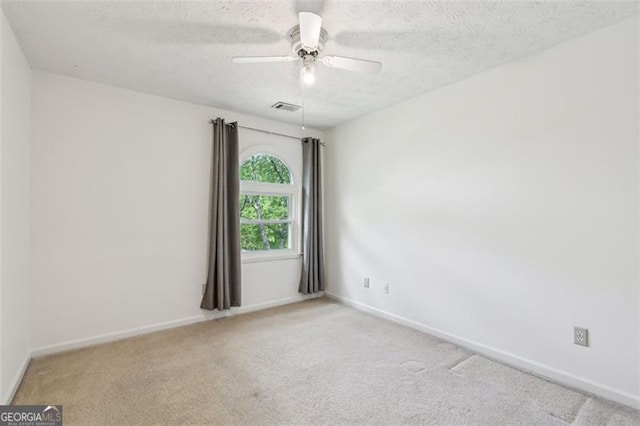 22 Oakwood Hills Dr, Suwanee, GA 30024 - unfurnished room featuring a ceiling fan, a textured ceiling, visible vents, baseboards, and carpet flooring