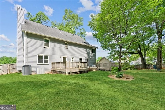 22 Oakwood Hills Dr, Suwanee, GA 30024 - back of house featuring central AC, a deck, a fenced backyard, a chimney, and a yard
