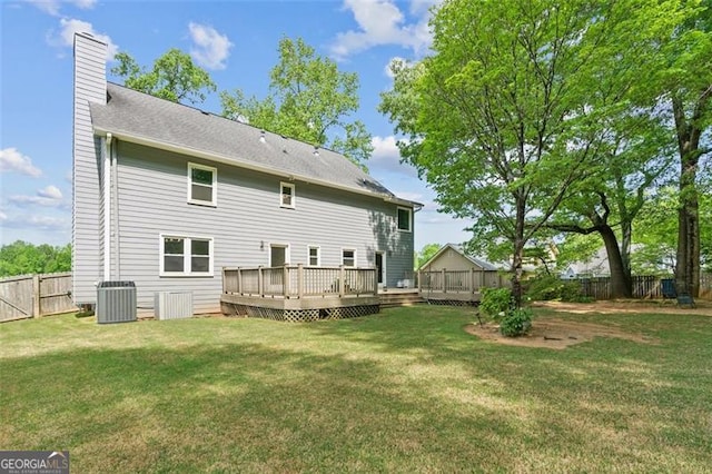 22 Oakwood Hills Dr, Suwanee, GA 30024 - rear view of house with a deck, cooling unit, a fenced backyard, a chimney, and a lawn