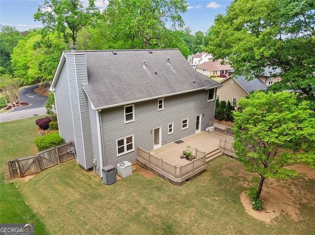 22 Oakwood Hills Dr, Suwanee, GA 30024 - back of property featuring fence, a deck, roof with shingles, a chimney, and a lawn