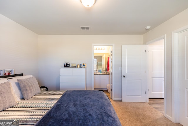 104 Catalpa Rd, Milner, GA 30257 - bedroom featuring light carpet, ensuite bathroom, and visible vents