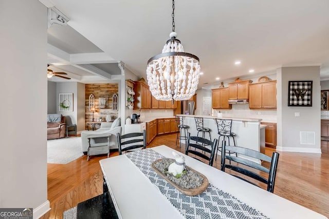 1738 Honey Tree Pl, Hoschton, GA 30548 - dining space featuring a chandelier, light wood-style flooring, recessed lighting, a ceiling fan, and beamed ceiling