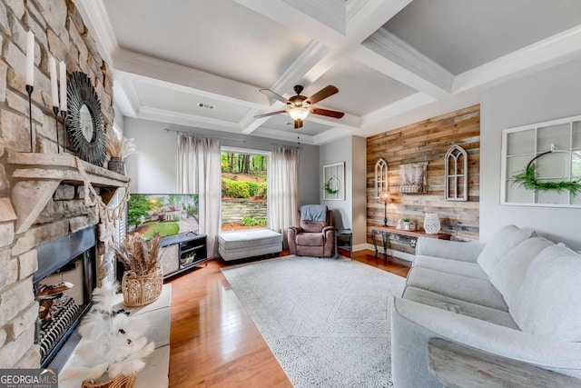 1738 Honey Tree Pl, Hoschton, GA 30548 - living room with coffered ceiling, a fireplace, wood finished floors, a ceiling fan, and ornamental molding
