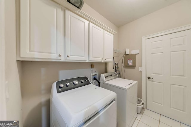 1738 Honey Tree Pl, Hoschton, GA 30548 - laundry room featuring separate washer and dryer, cabinet space, and light tile patterned floors