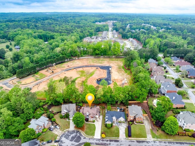 1738 Honey Tree Pl, Hoschton, GA 30548 - aerial overview of property's location featuring a heavily wooded area and nearby suburban area