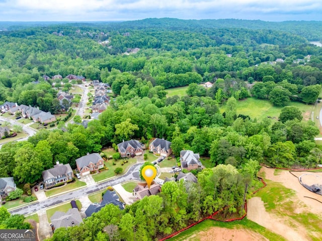 1738 Honey Tree Pl, Hoschton, GA 30548 - aerial view of residential area featuring a forest