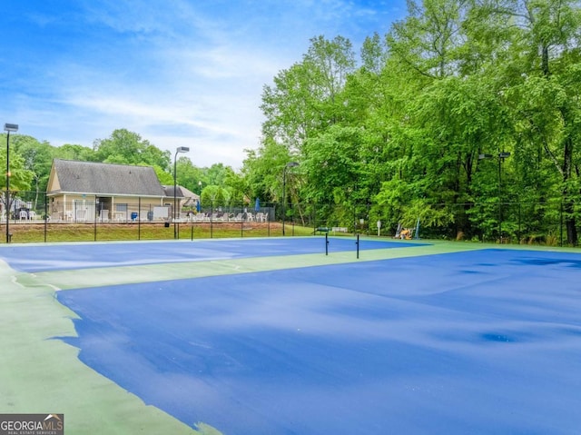 1738 Honey Tree Pl, Hoschton, GA 30548 - view of tennis court with view of scattered trees