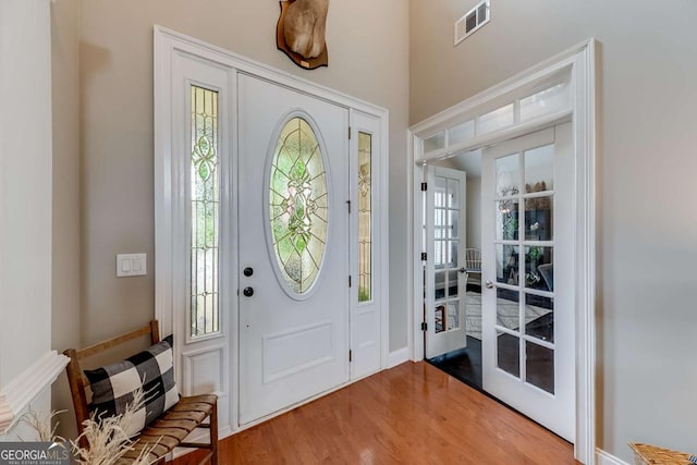 1738 Honey Tree Pl, Hoschton, GA 30548 - foyer featuring french doors and wood finished floors