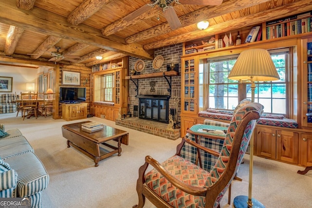 living room featuring carpet floors, ceiling fan, a wealth of natural light, and wood ceiling