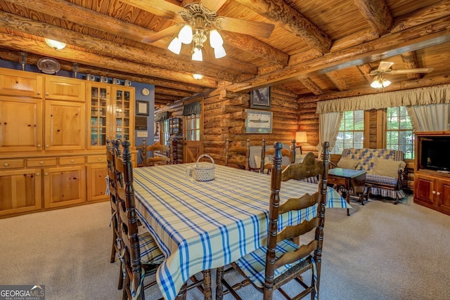 dining room featuring wooden ceiling, ceiling fan, light carpet, and log walls