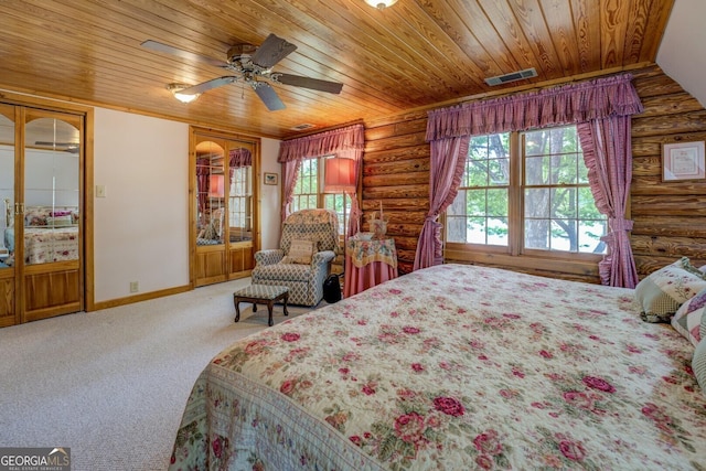 carpeted bedroom with baseboards, log walls, visible vents, and wood ceiling