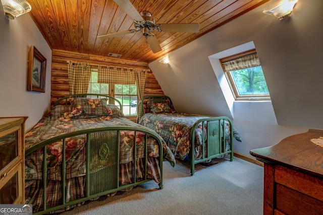 bedroom with visible vents, lofted ceiling, baseboards, wooden ceiling, and carpet