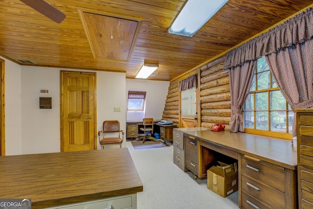office space with visible vents, rustic walls, attic access, light colored carpet, and wood ceiling