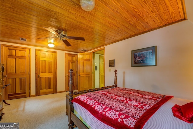 carpeted bedroom with wooden ceiling and visible vents