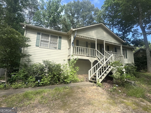 408 Walnut Dr, Woodstock, GA 30189 - view of front of home featuring a porch and stairway