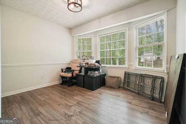 408 Walnut Dr, Woodstock, GA 30189 - office with wood finished floors, a textured ceiling, and baseboards