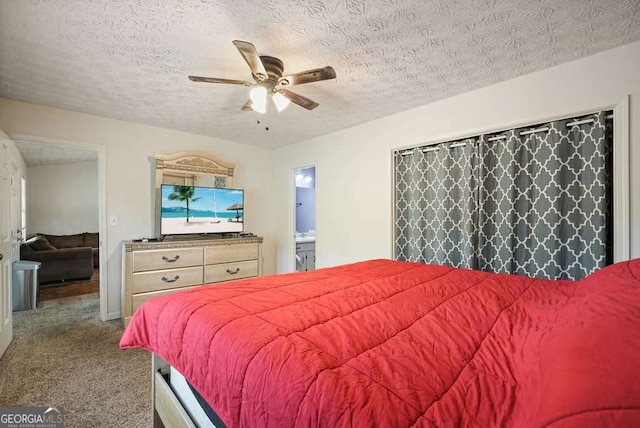 408 Walnut Dr, Woodstock, GA 30189 - bedroom with carpet, a textured ceiling, ceiling fan, and connected bathroom