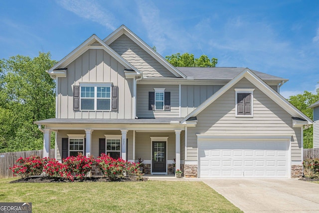 207 Cherokee Reserve Cir, Canton, GA 30115 - craftsman-style home featuring fence, board and batten siding, a front yard, and concrete driveway