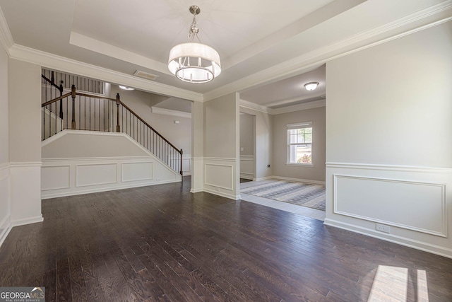 207 Cherokee Reserve Cir, Canton, GA 30115 - unfurnished living room featuring stairs, a decorative wall, wood-type flooring, a notable chandelier, and a tray ceiling
