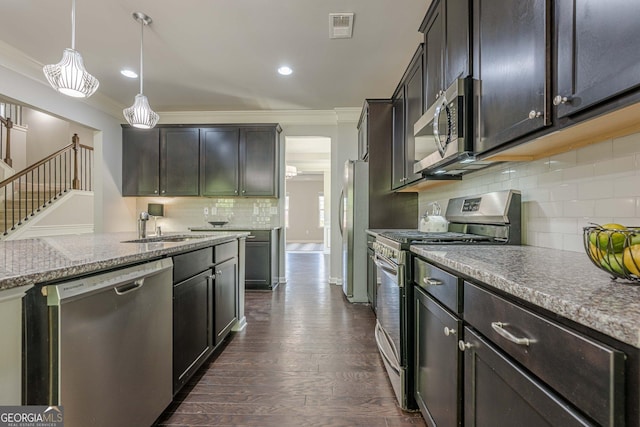 207 Cherokee Reserve Cir, Canton, GA 30115 - kitchen featuring visible vents, backsplash, ornamental molding, appliances with stainless steel finishes, and dark wood finished floors