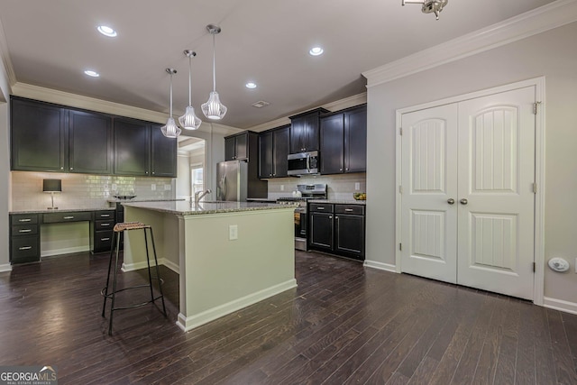 207 Cherokee Reserve Cir, Canton, GA 30115 - kitchen featuring light stone countertops, a kitchen breakfast bar, backsplash, ornamental molding, and appliances with stainless steel finishes